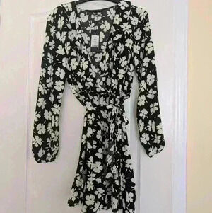 Dynamite size Medium Long sleeve black with white flowers  dress